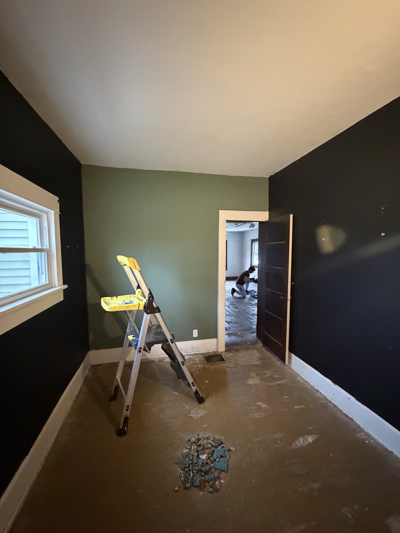 Interior room with green and dark accent walls