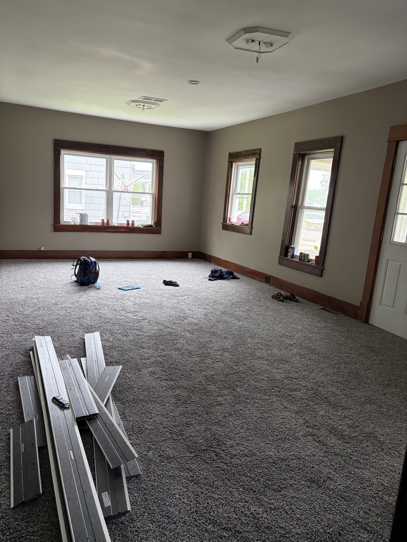Light-colored interior walls with dark wood window trim