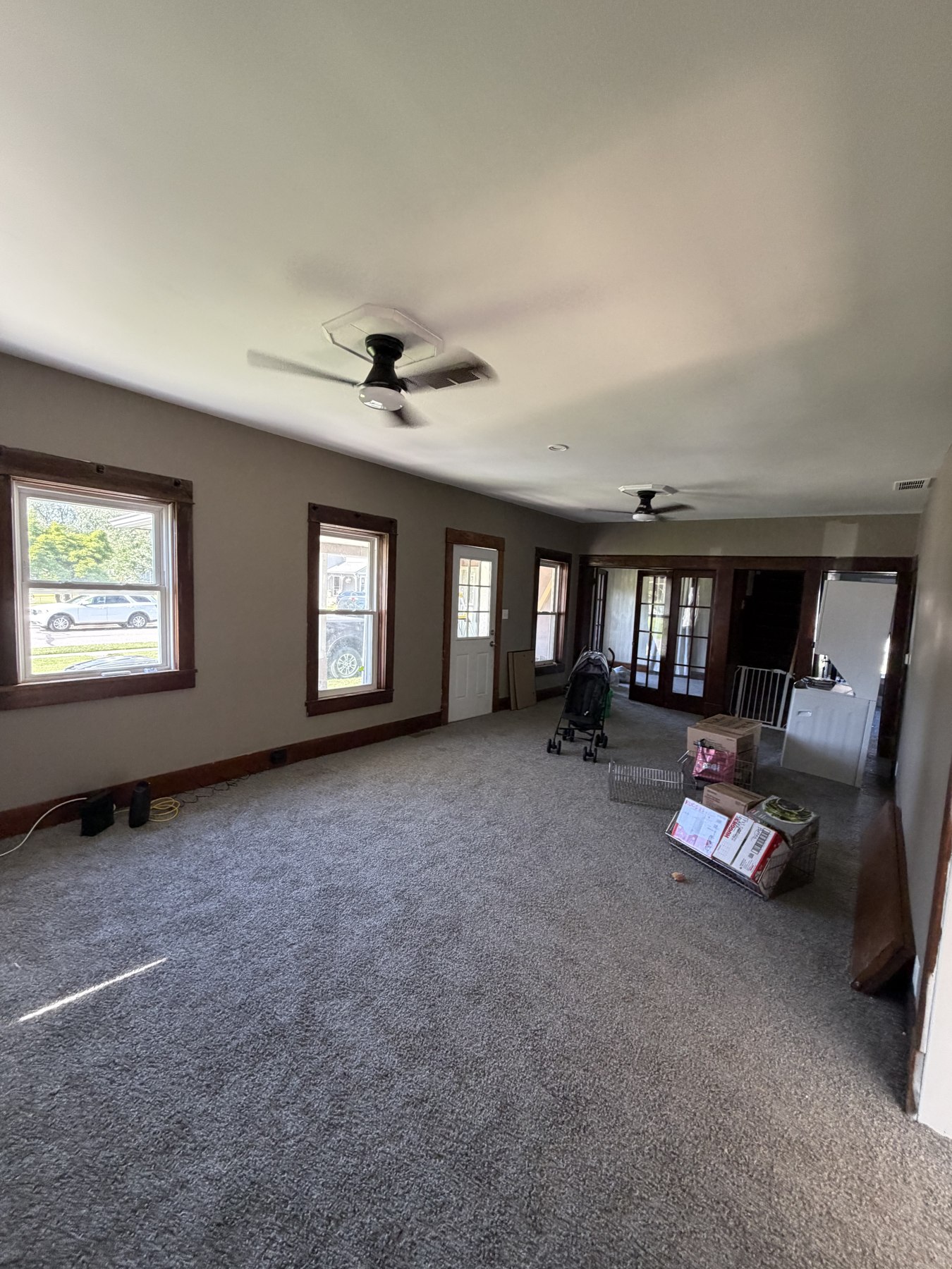 Living room with light-painted walls and dark wood trim